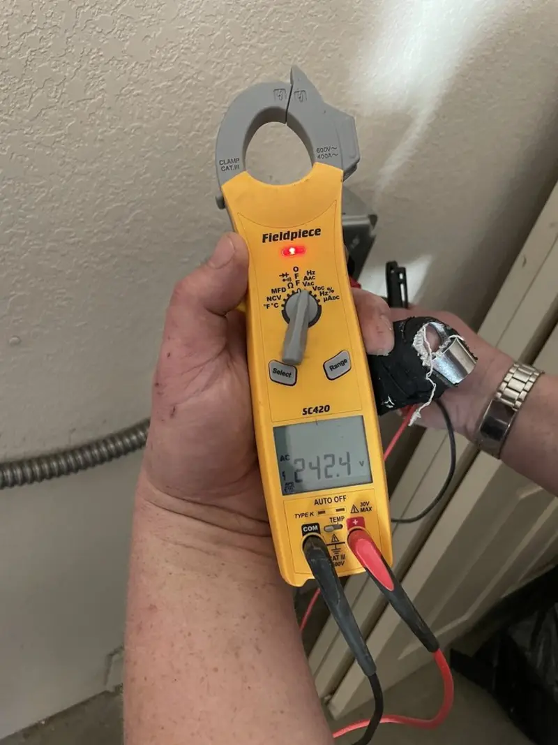 Voltage testing with clamp meter during Ceiling Fan Installation in Commerce